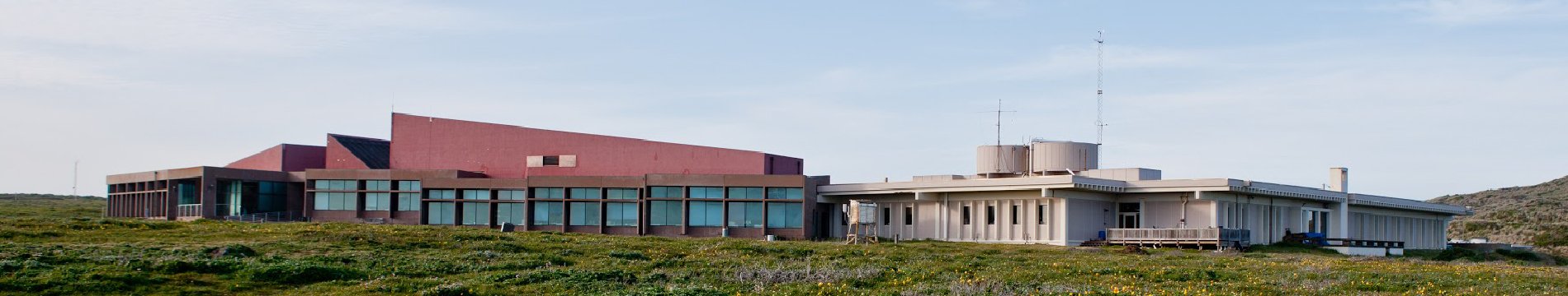A research facility beneath a wide sky