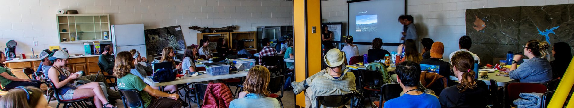 A group workshop in a room with yellow walls